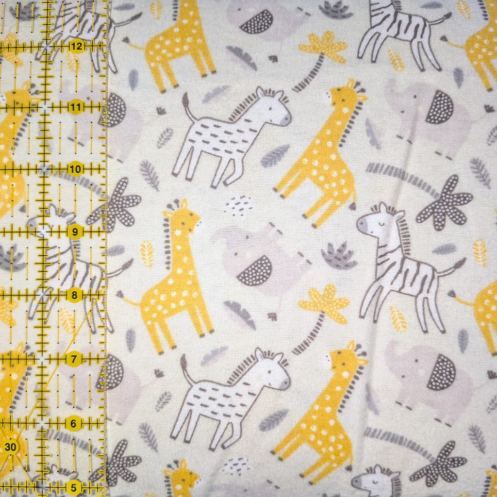 Camelot Fabrics ~ BUNGLE In The JUNGLE ~ FLANNEL ~  White, Yellow, and Gray ~ Sold by the 1/2 Yard