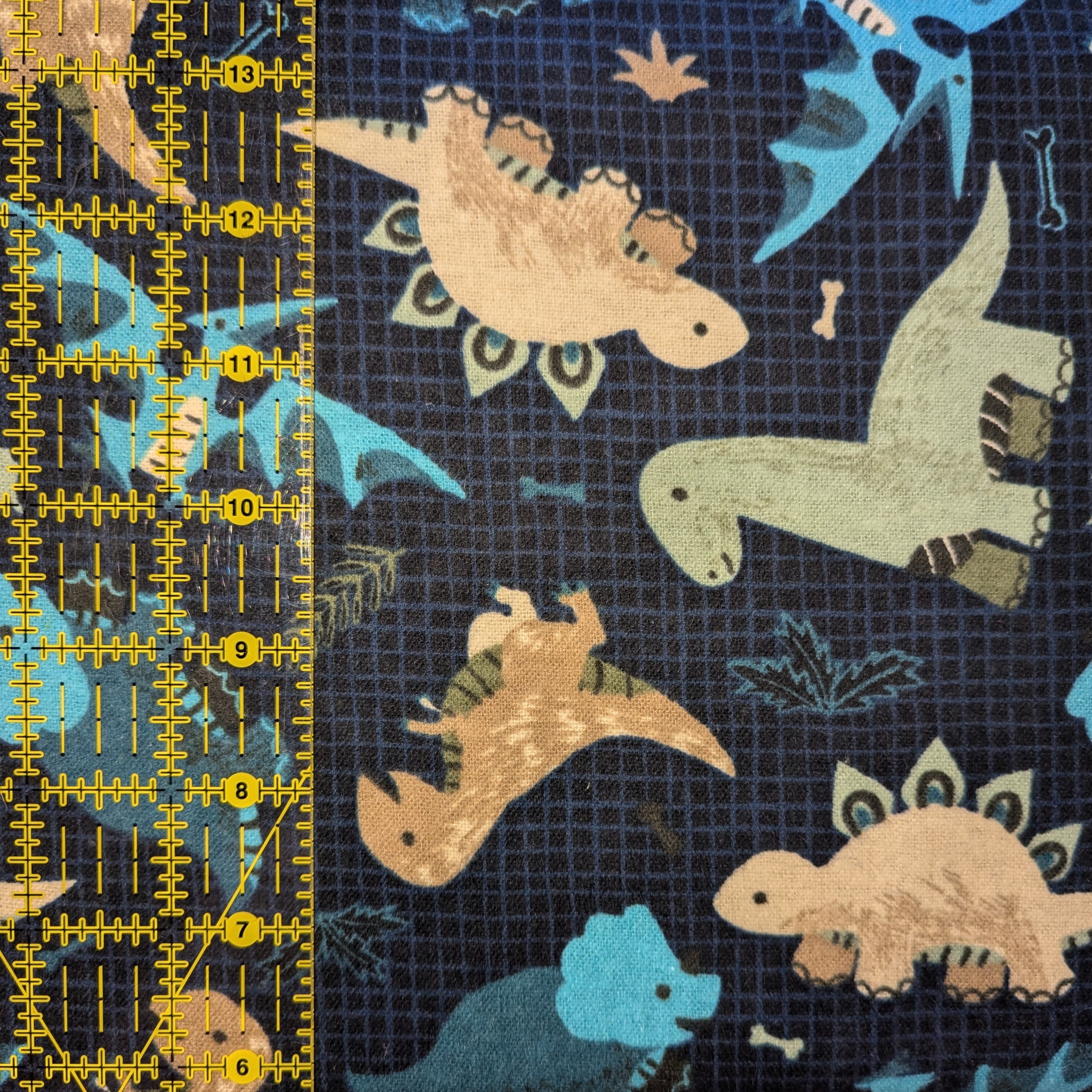 David Textiles ~ GOING DINO Toss ~ FLANNEL ~ Blue ~ Sold by the 1/2 Yard