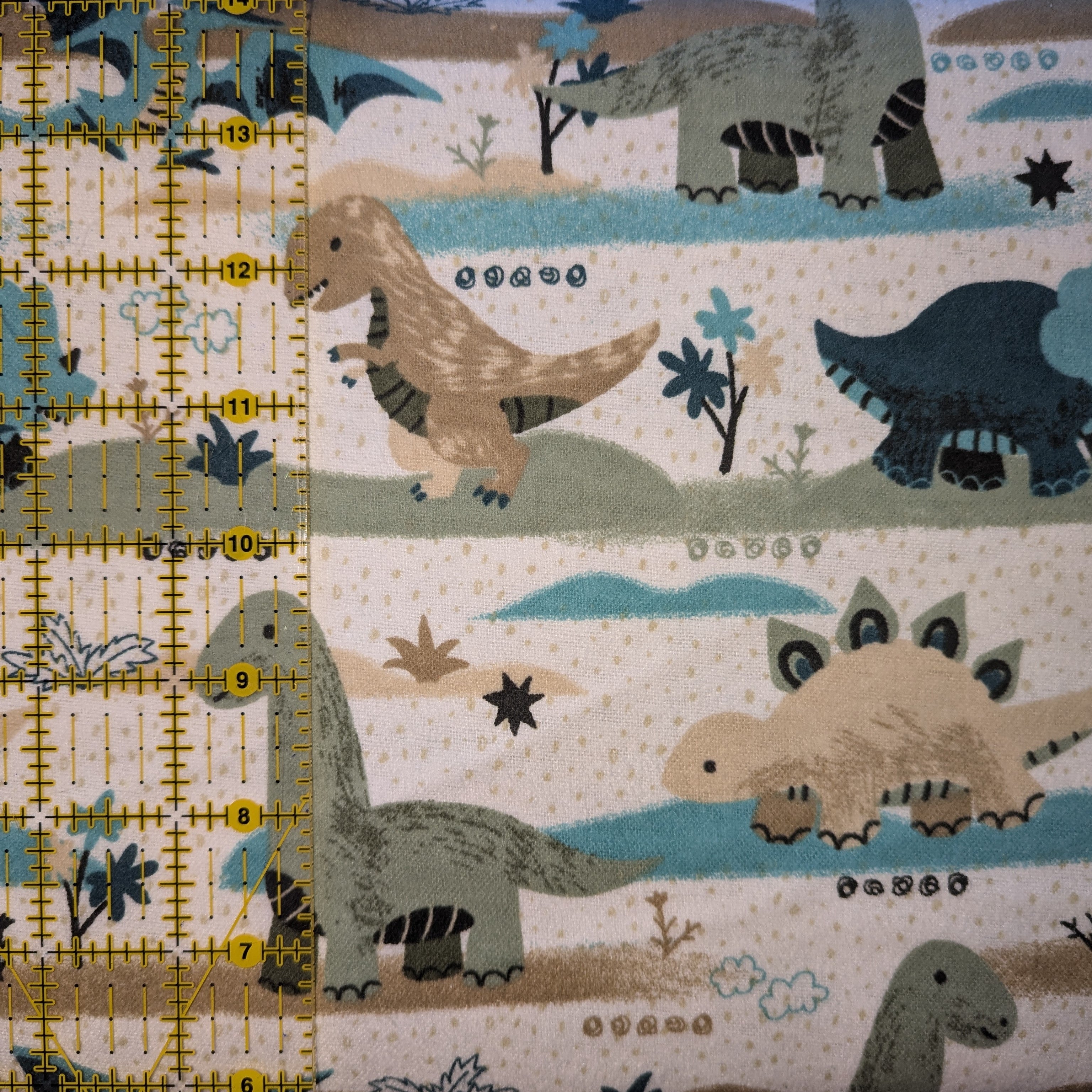 David Textiles ~ GOING DINO ~ FLANNEL ~ White ~ Sold by the 1/2 Yard