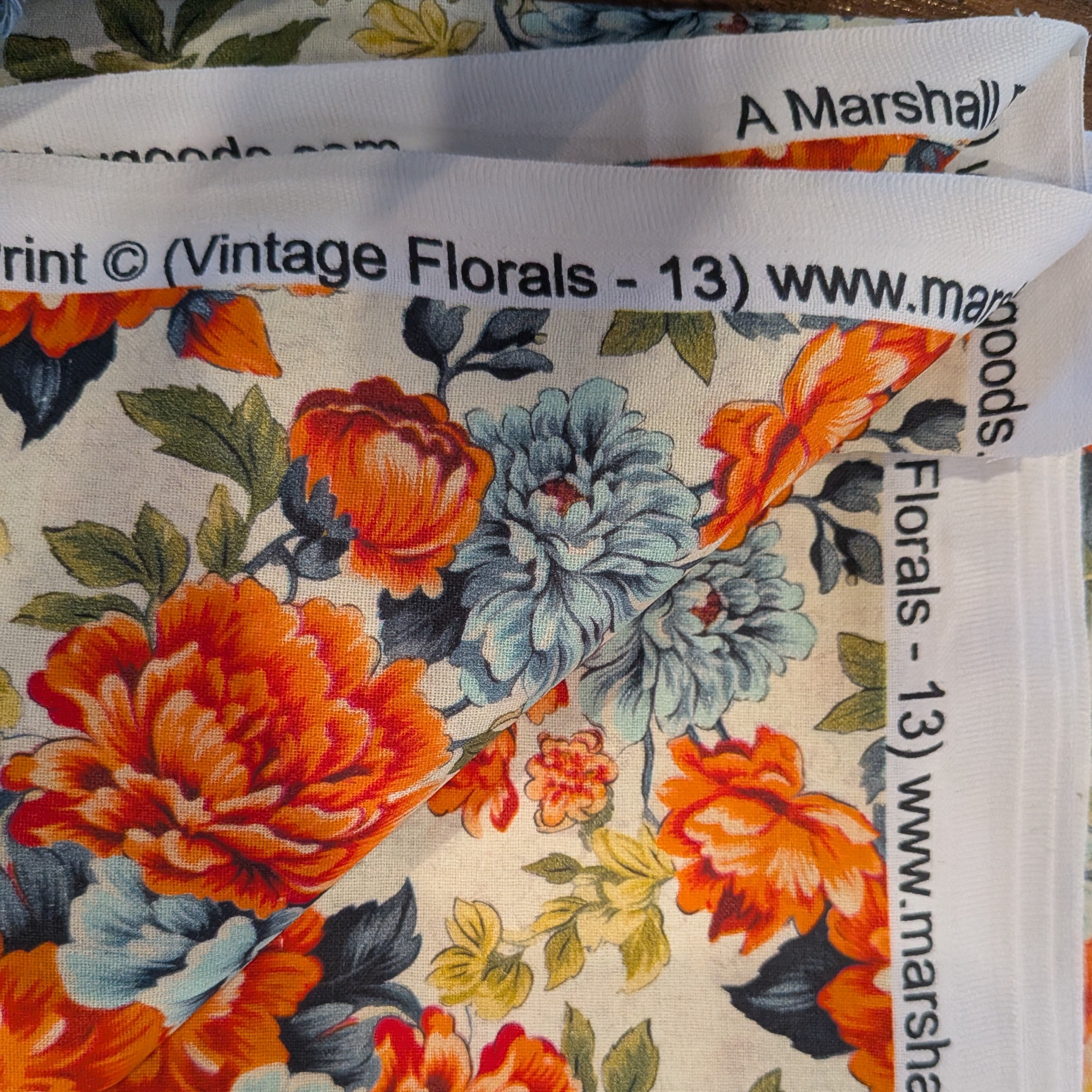Marshall Dry Goods ~ VINTAGE FLORAL 13 ~ Orange and Blue Flowers on Cream Background ~ Sold by the 1/2 Yard