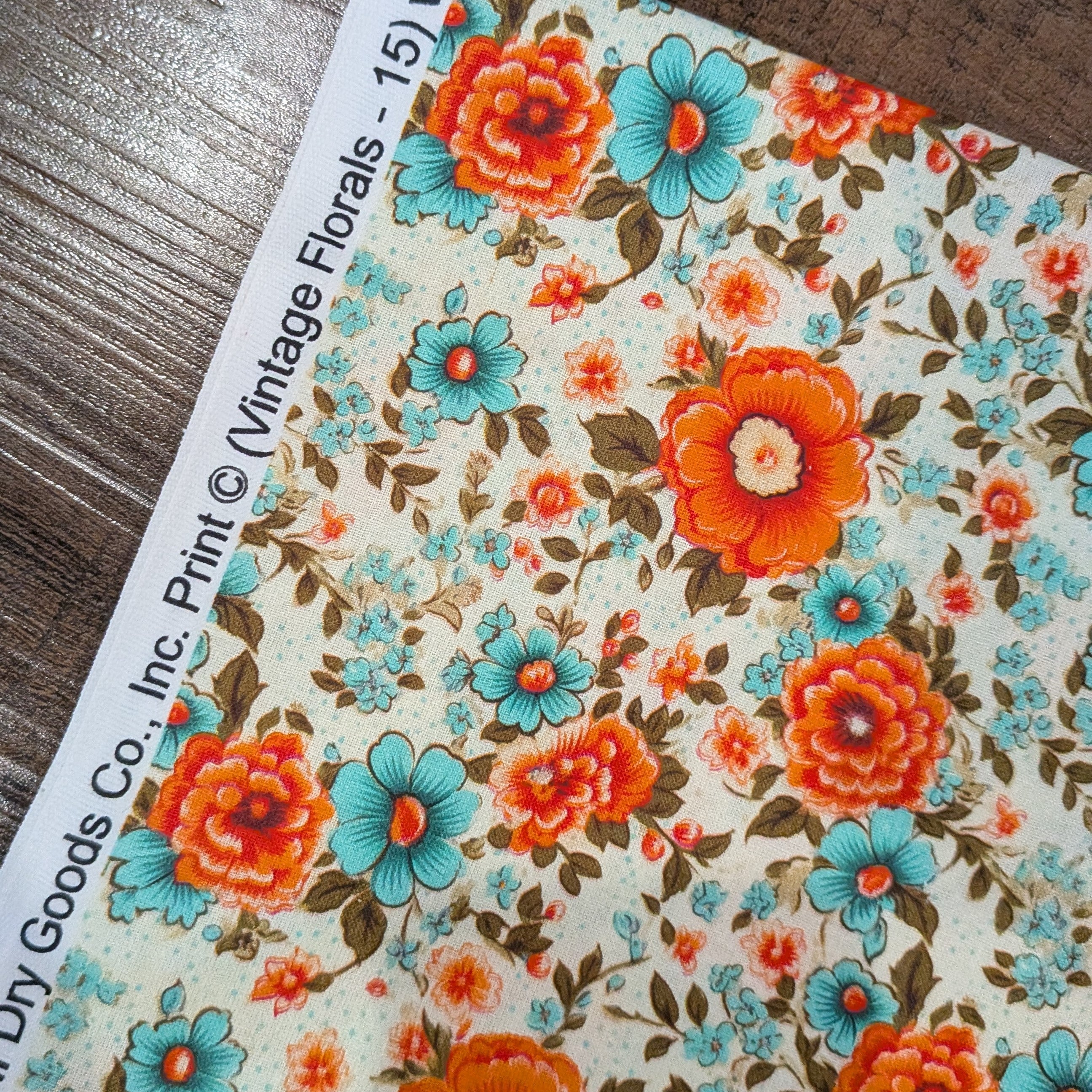 Marshall Dry Goods ~ VINTAGE FLORAL 15 ~ Orange and Aqua Flowers on Cream Background ~ Sold by the 1/2 Yard