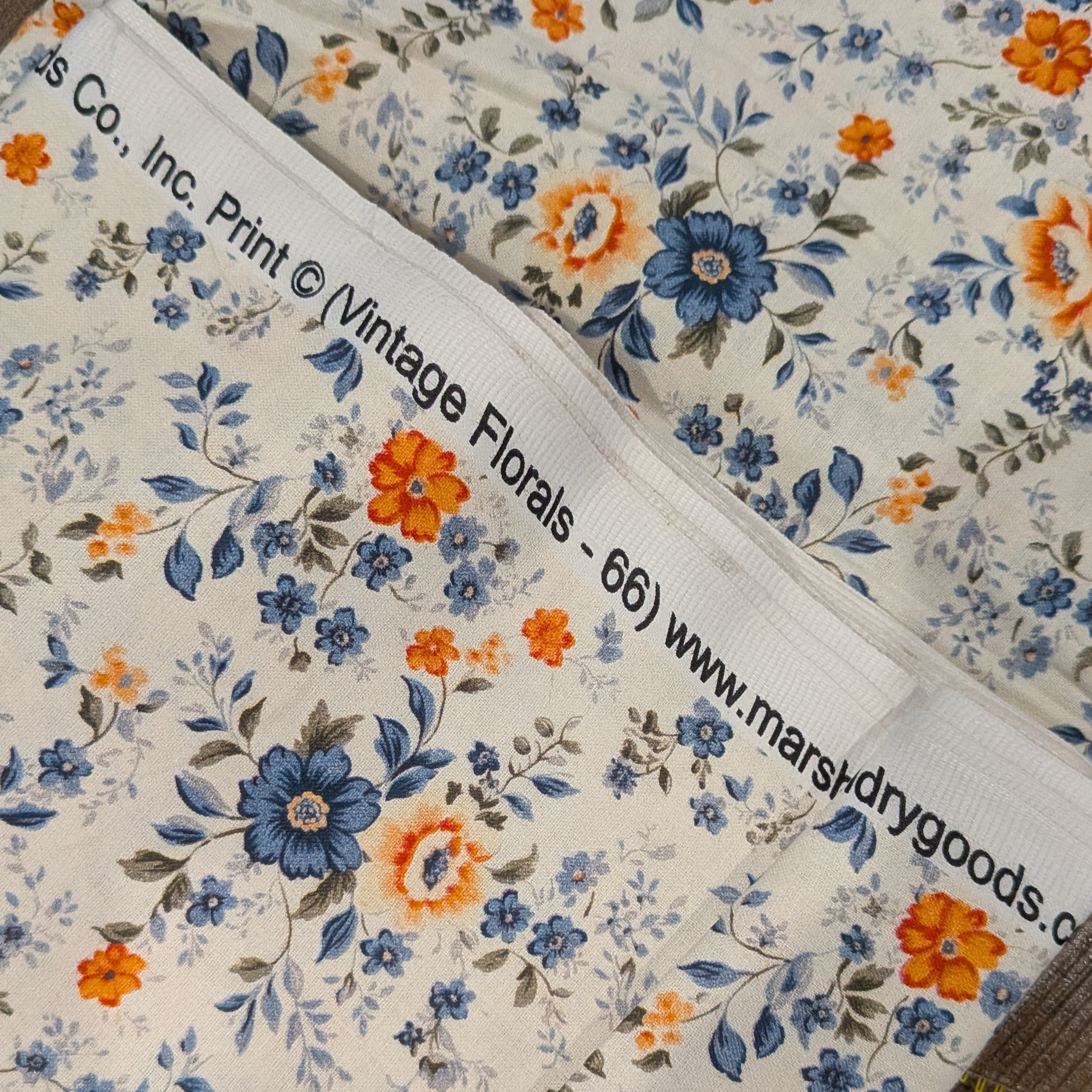 Marshall Dry Goods ~ VINTAGE FLORAL 66 ~ Orange and Blue Flowers on Cream Background ~ Sold by the 1/2 Yard