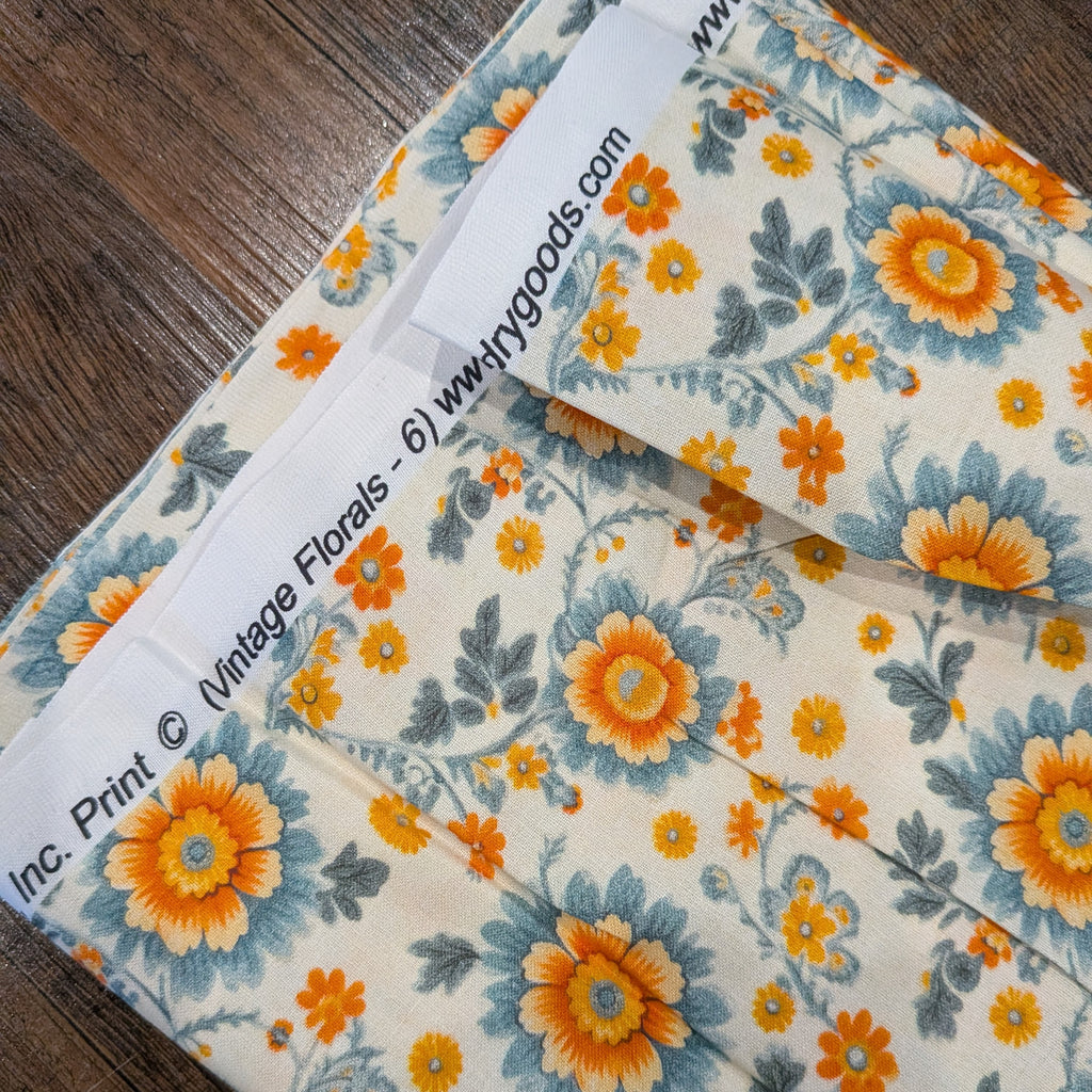Marshall Dry Goods ~ VINTAGE FLORAL 6 ~ Orange and Blue Flowers on Cream Background ~ Sold by the 1/2 Yard