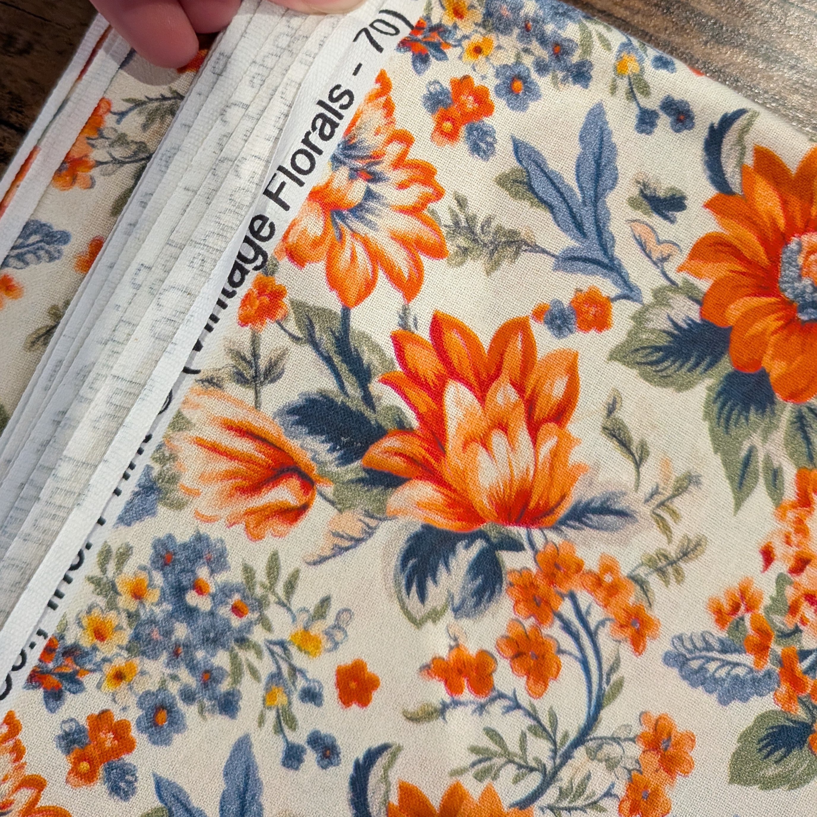 Marshall Dry Goods ~ VINTAGE FLORAL 70 ~ Orange and Blue Flowers on Cream Background ~ Sold by the 1/2 Yard