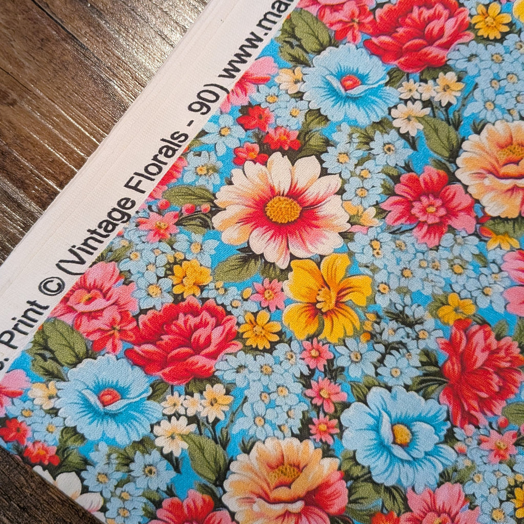 Marshall Dry Goods ~ VINTAGE FLORAL 90 ~ Pink, Blue and Yellow Flowers on Blue Background ~ Sold by the 1/2 Yard