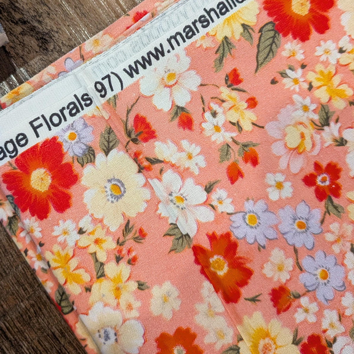 Marshall Dry Goods ~ VINTAGE FLORAL 97 ~ Reddish Orange, Blue and Yellow Flowers on Pink Background ~ Sold by the 1/2 Yard