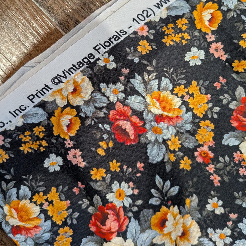Marshall Dry Goods ~ VINTAGE FLORAL 102 ~ Orange, Red, Blue and Yellow Flowers on Black Background ~ Sold by the 1/2 Yard