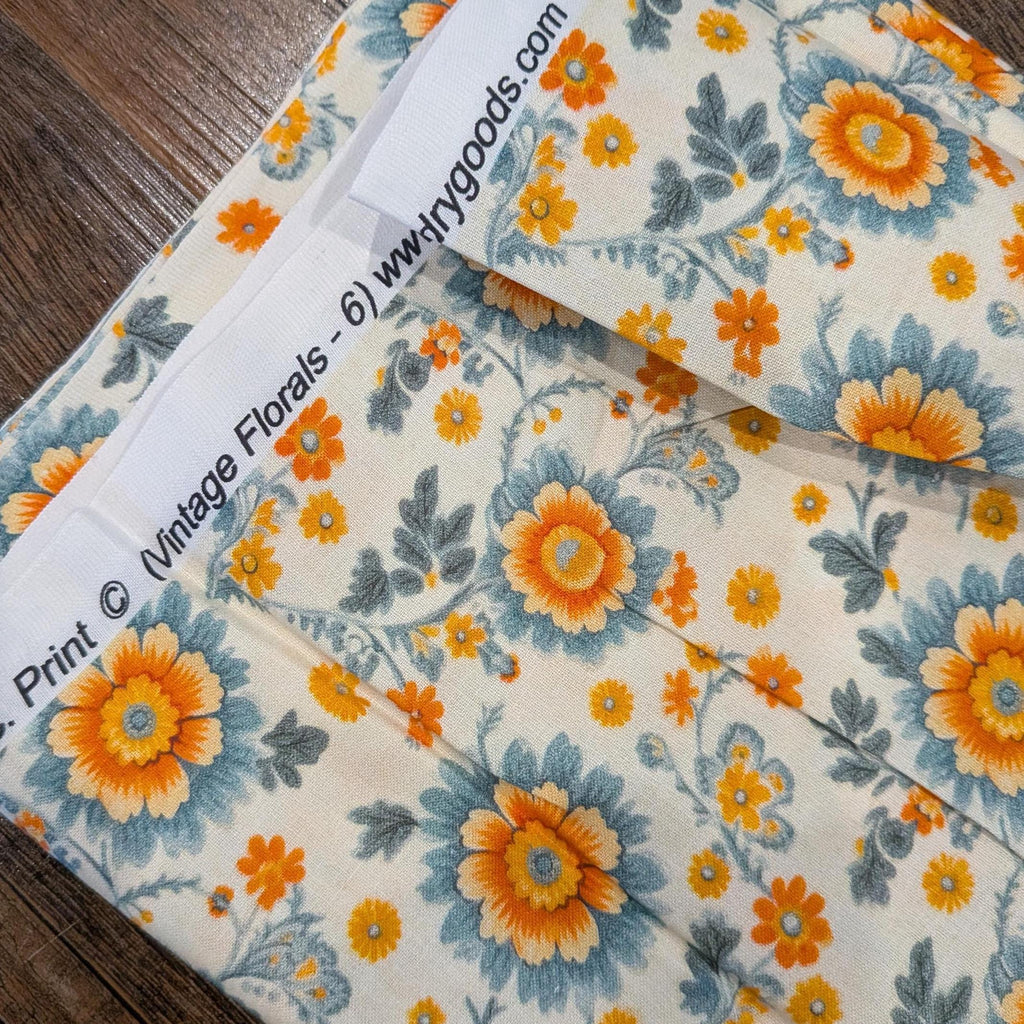 Marshall Dry Goods ~ VINTAGE FLORAL 6 ~ Orange and Blue Flowers on Cream Background ~ Sold by the 1/2 Yard