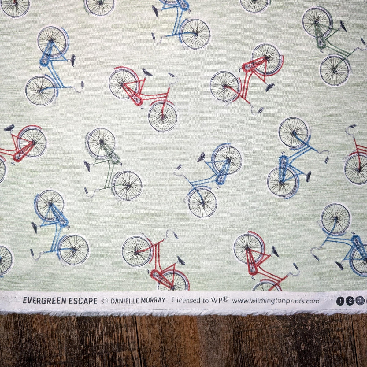 Wilmington Prints ~ Evergreen Escape ~ BIKE TOSS ~ Sand or Sage ~ Sold by the 1/2 Yard